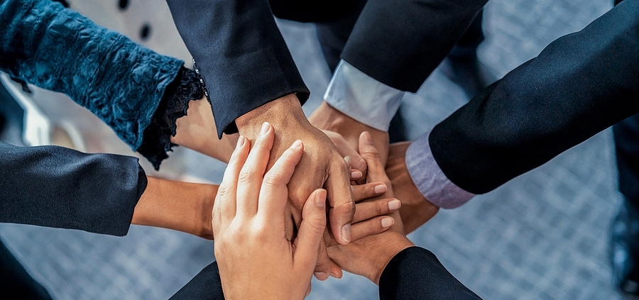 A group of people that are holding hands.